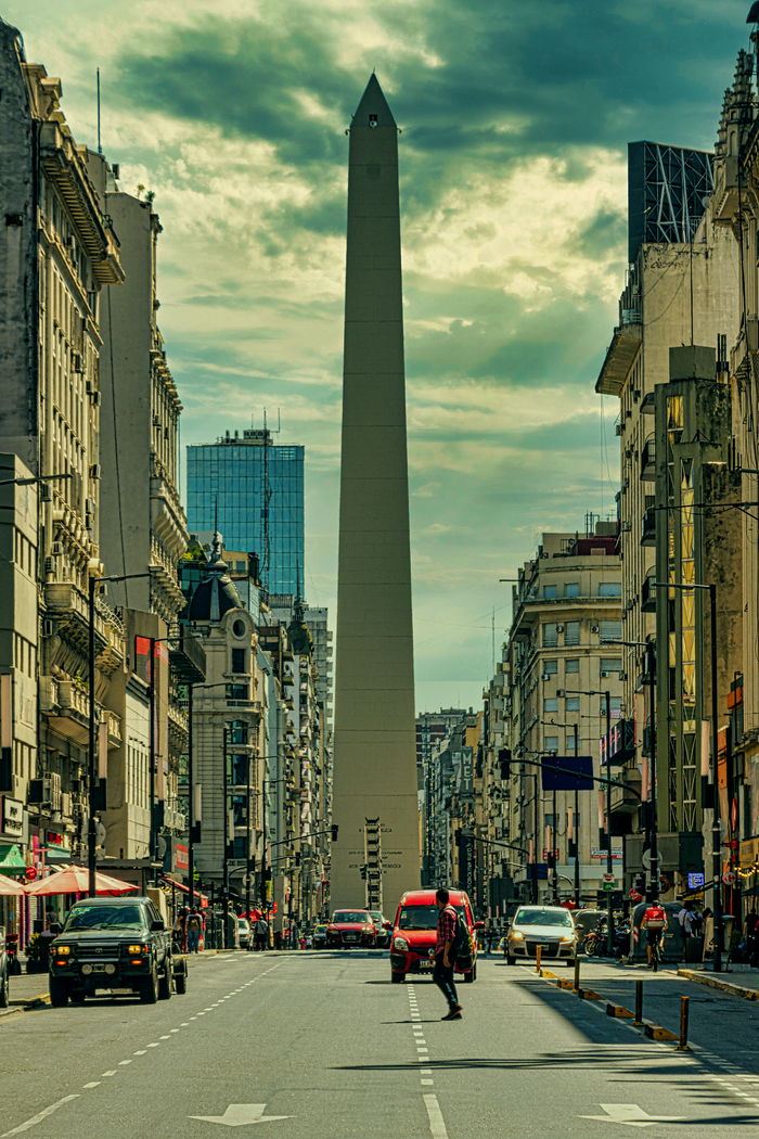 Captivating view of the Obelisk in Buenos Aires along Avenida 9 de Julio on a bustling day.